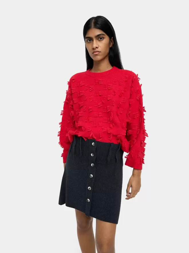Knitted jumper with fringes
