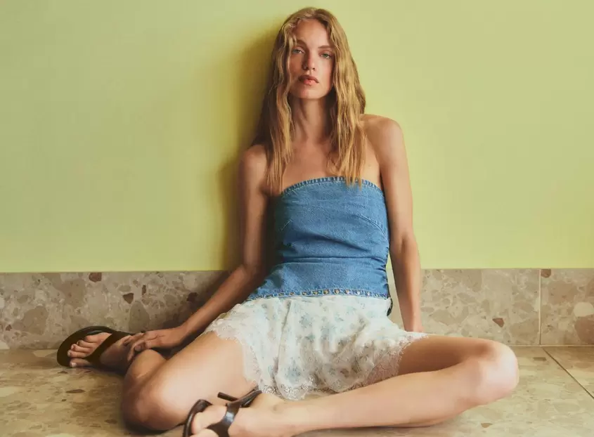 Asymmetric denim bandeau top with studs