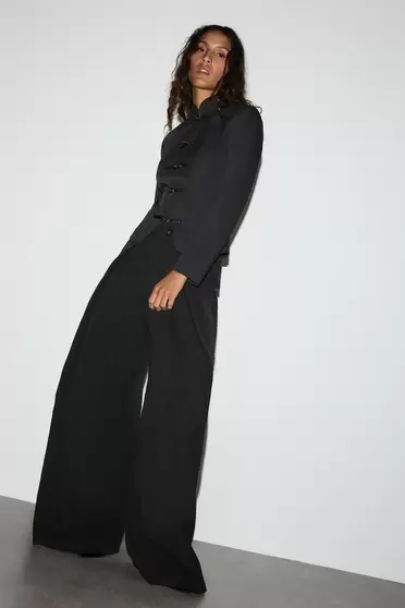 Pantalón wide leg pliegues