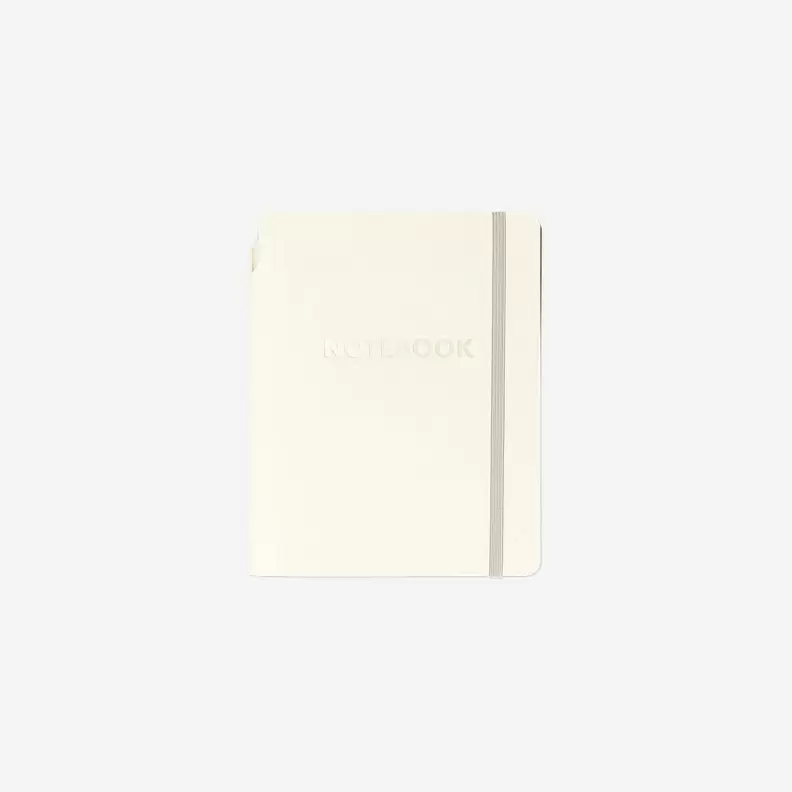 Beige notesbog med kuglepen
