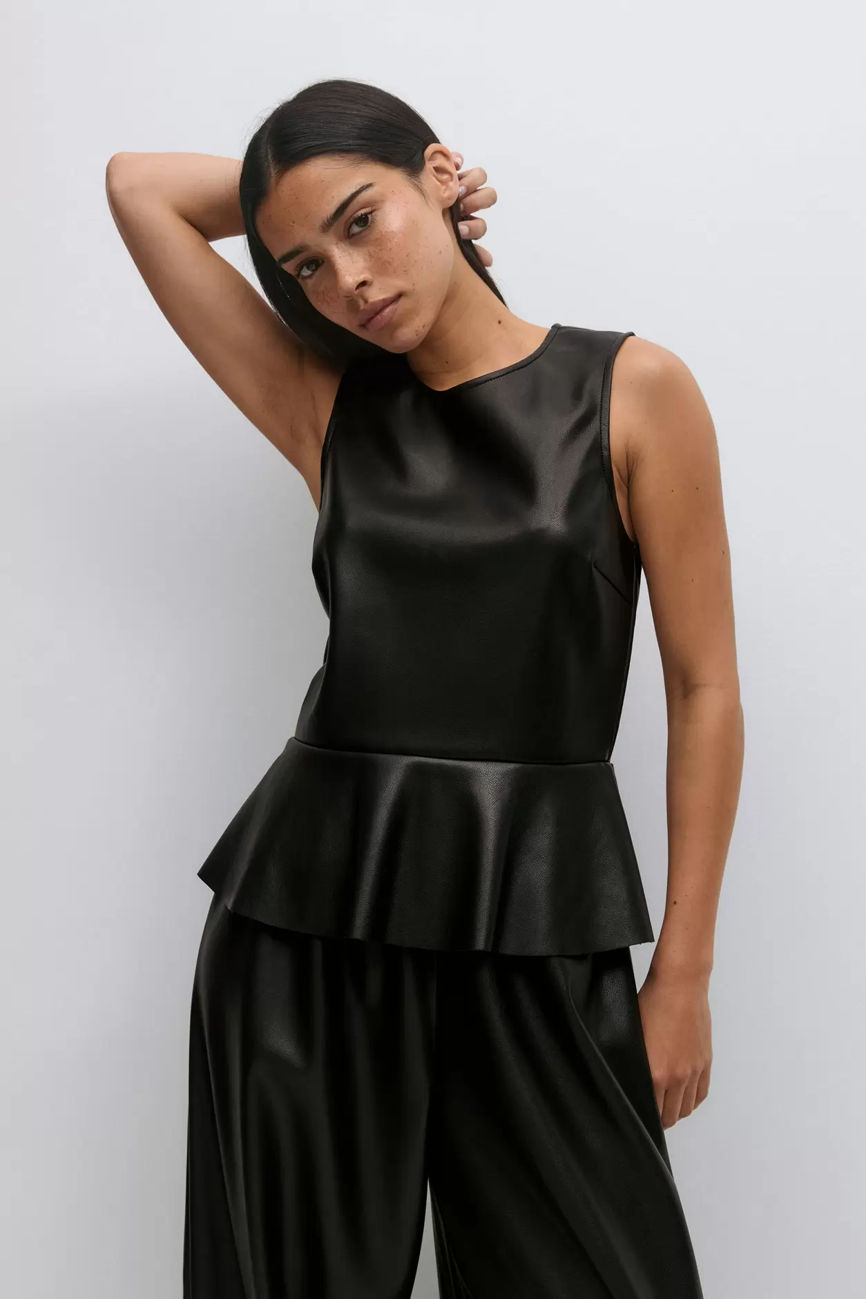 Pu peplum top