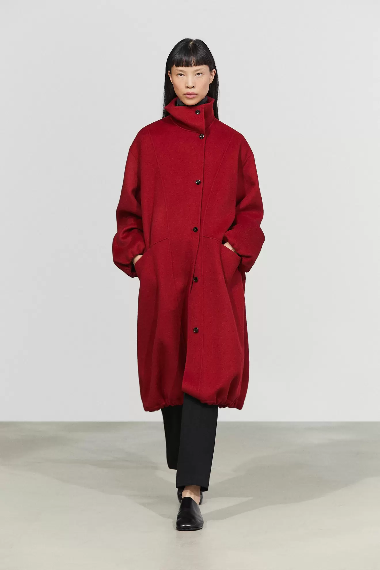 Long coat with asymmetrical collar detail