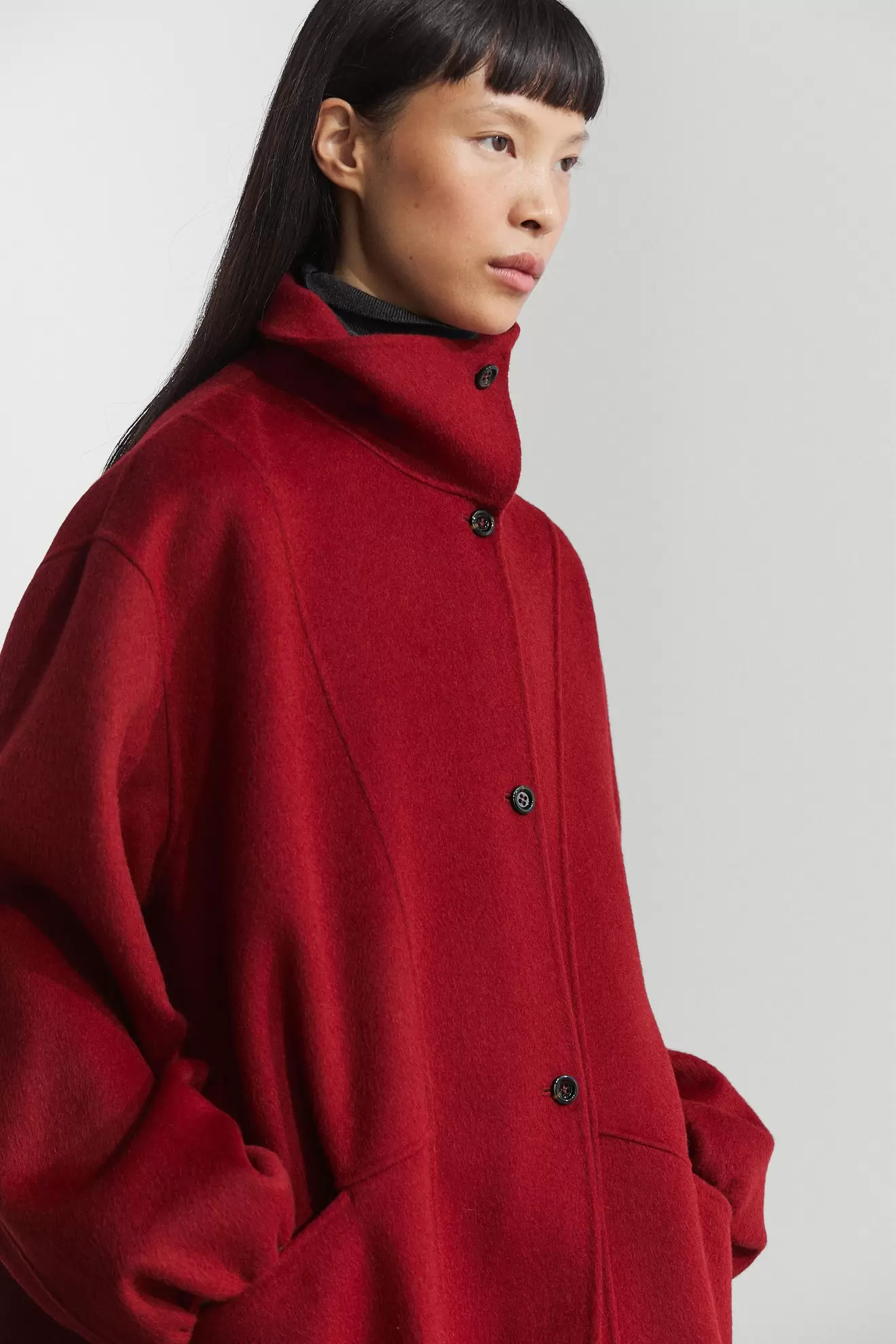 Long coat with asymmetrical collar detail