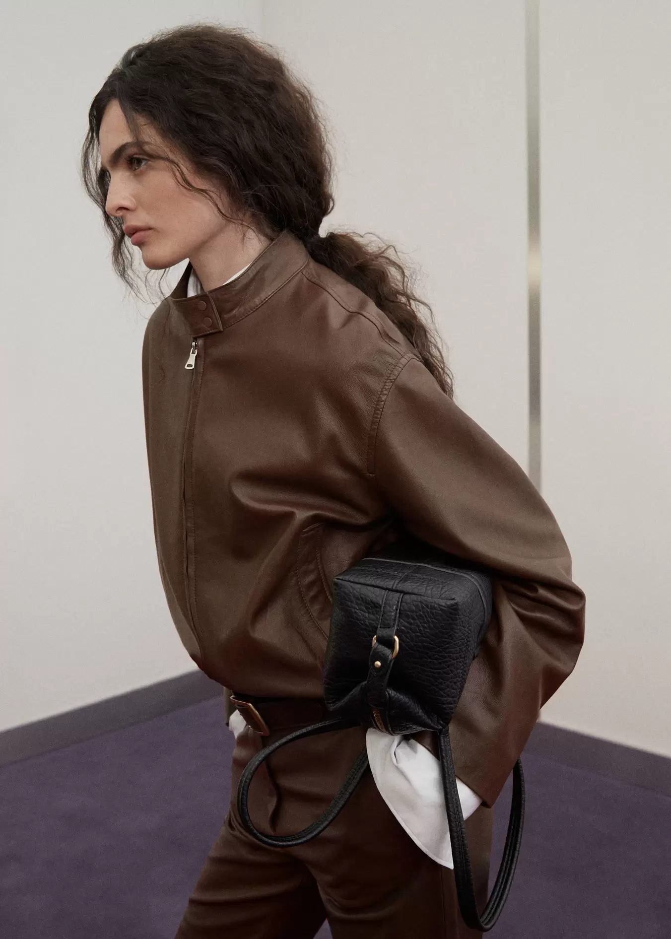 Leather jacket with strap collar