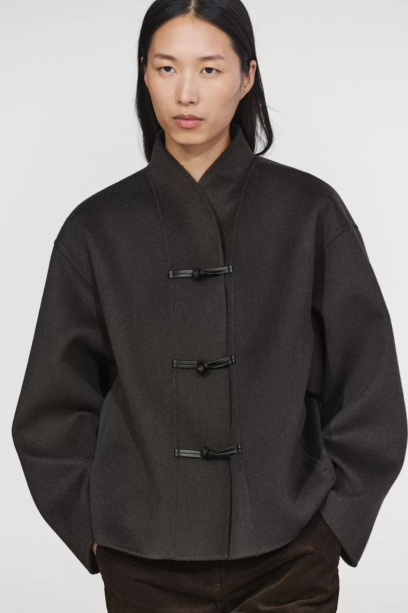 Short wool blend coat with button details