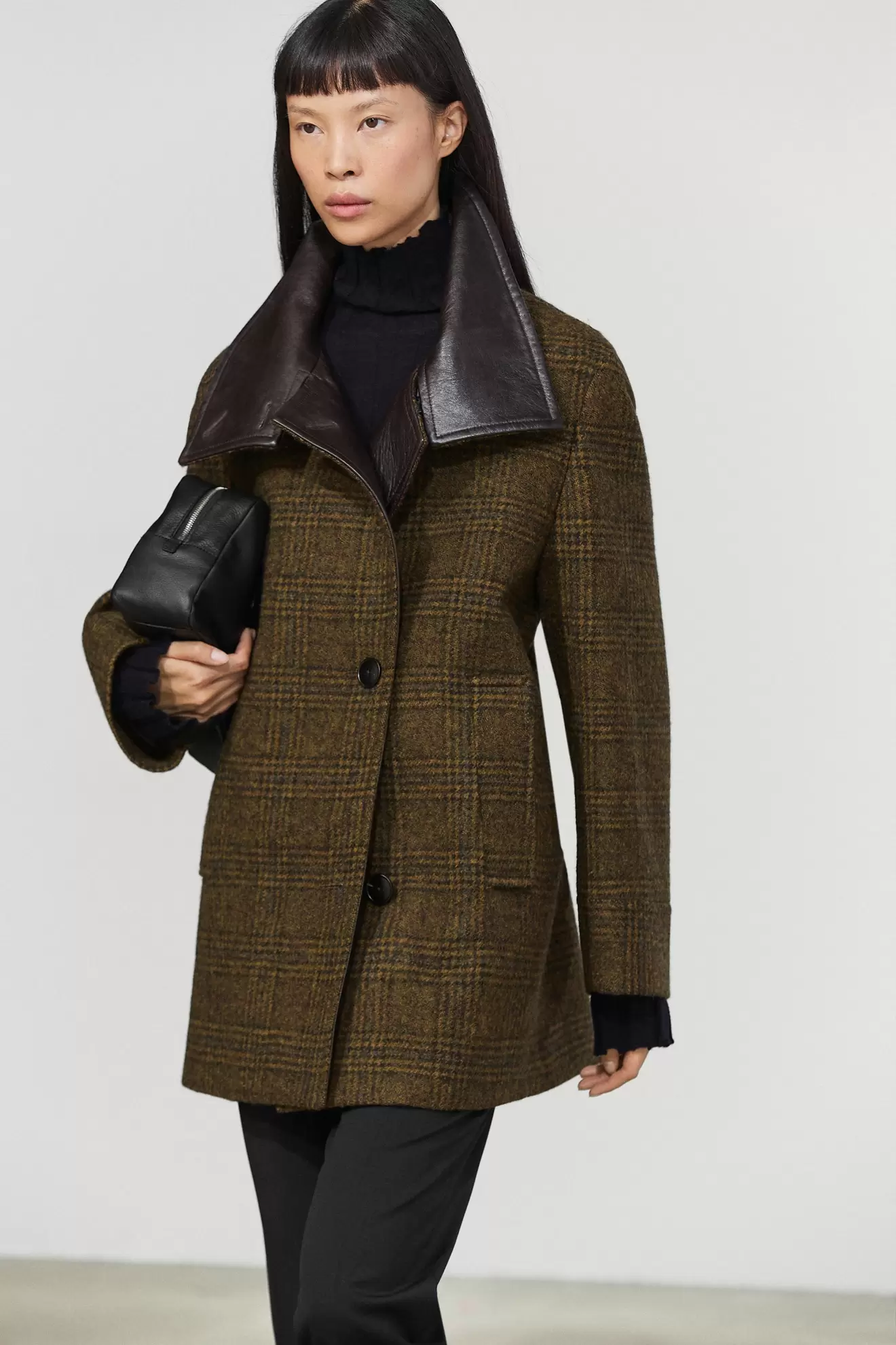 Mid-length check coat with leather contrast detail