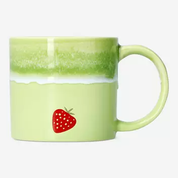 Grüner Matcha-Becher mit laufende...