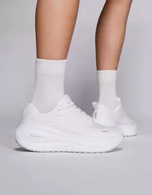 Nike Running Vomero Plus trainers in white