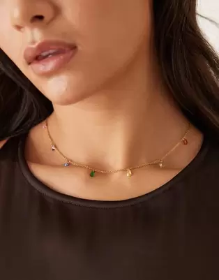 ASOS DESIGN stainless steel necklace with cubic zirconia rainbow gems in gold tone with gift bag