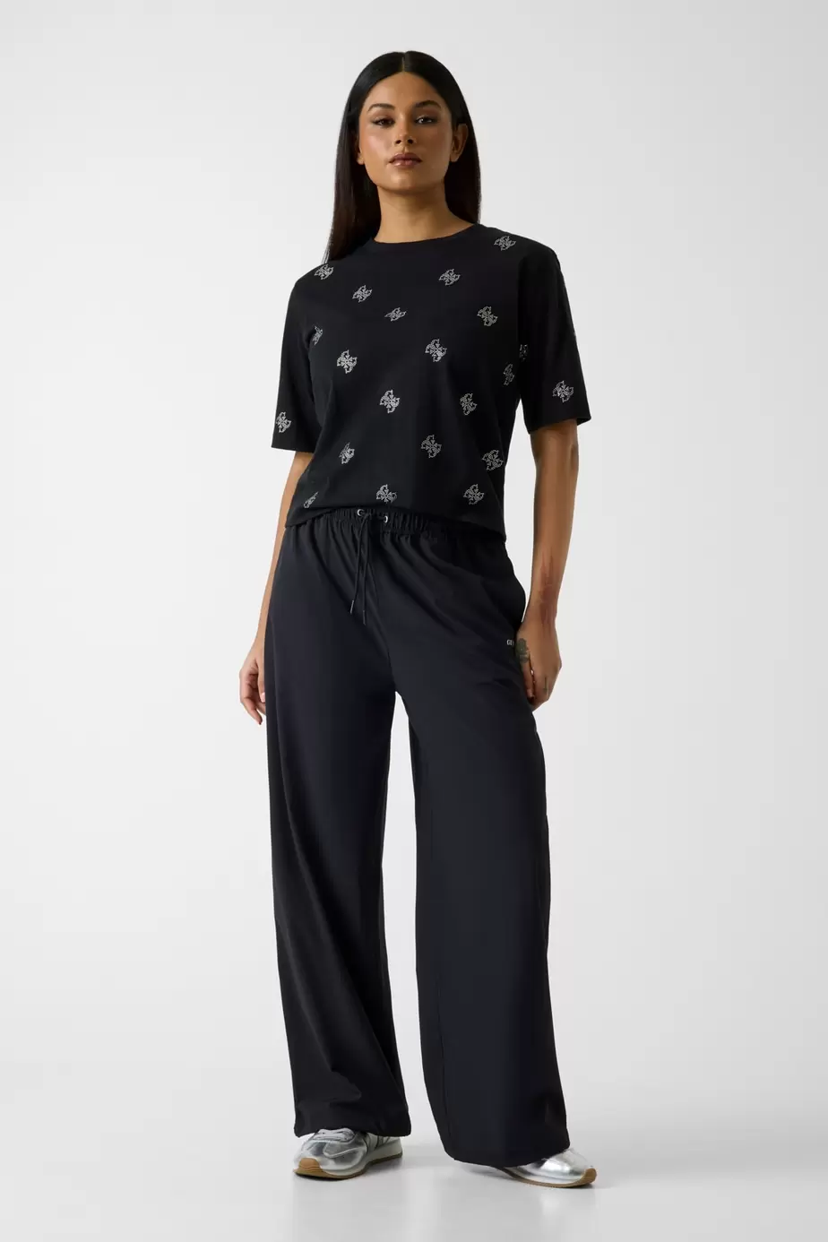Pantalones parachute con logo estampado
