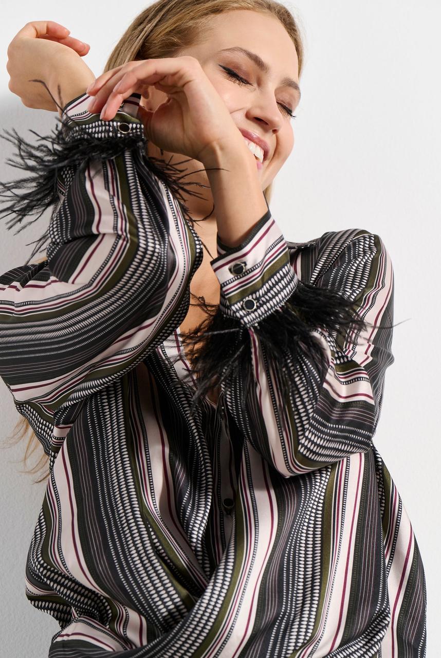 Striped wrap blouse with feathers