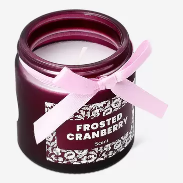 Scented candle with frosted cranberry fragrance