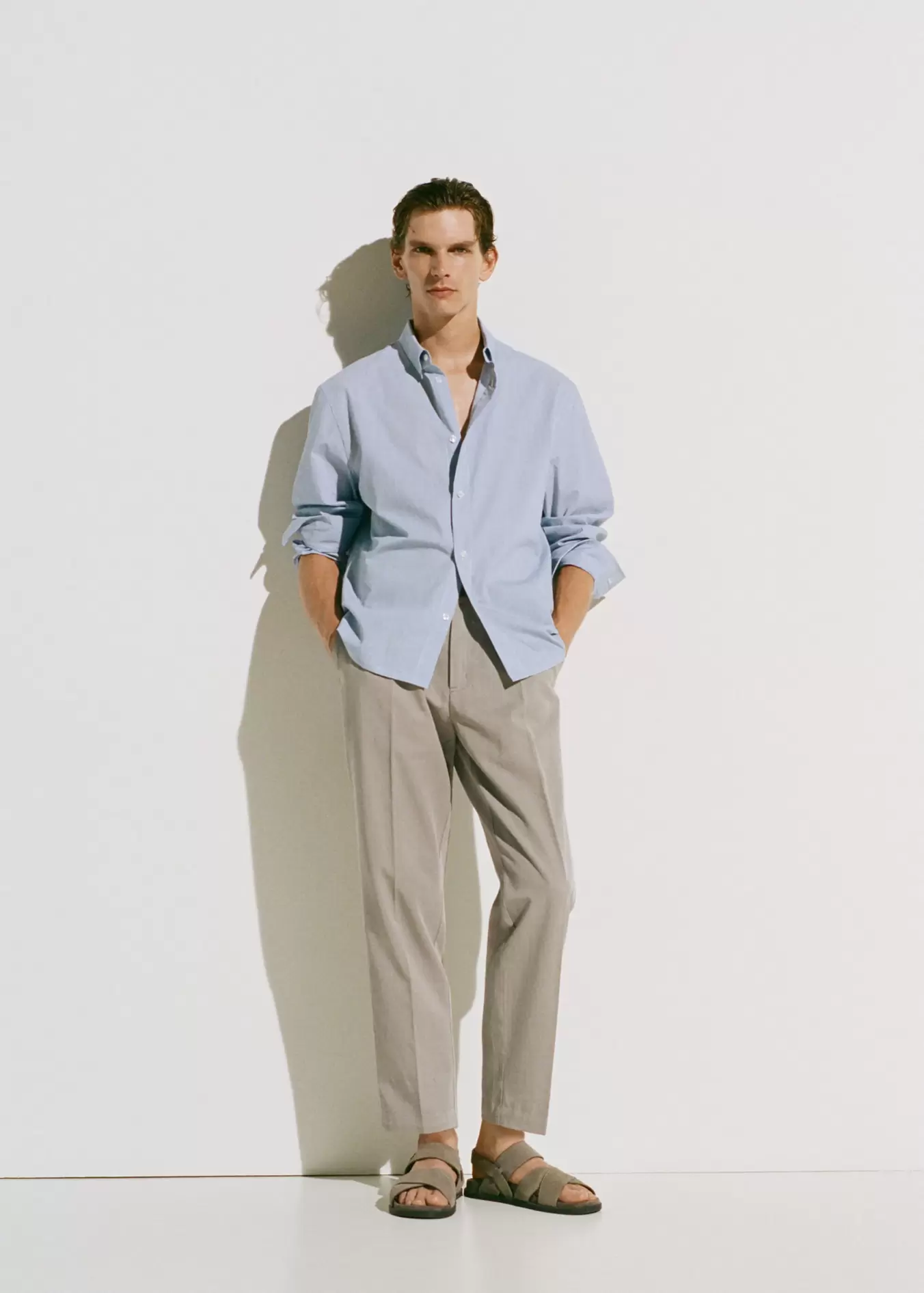 Cotton and lyocell straight-leg pleated trousers