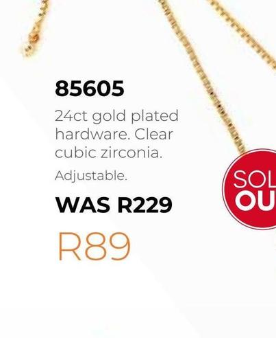 24ct gold plated hardware. Clear cubic zirconia