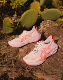Asics Novablast 5 trainers in pink and red