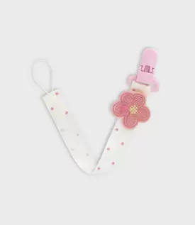 Porta chupete recién nacida con flor