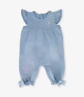 Enterito recién nacida con flores y vuelos