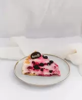  Cheesecake de Berries Porción