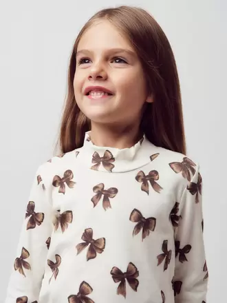 Polera niña con lazos