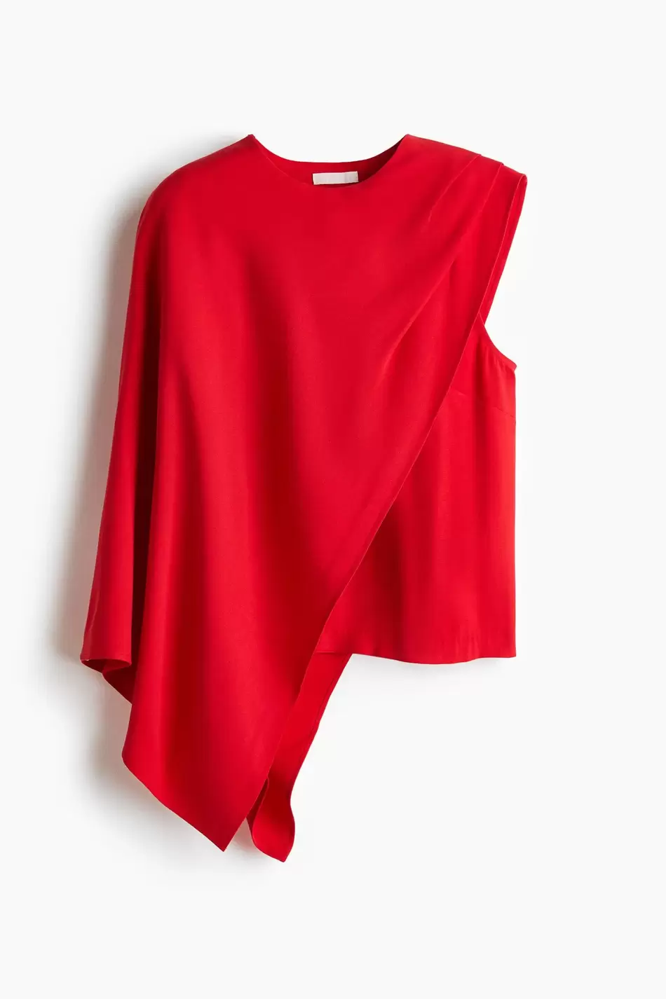 Blusa asimétrica con detalle de capa