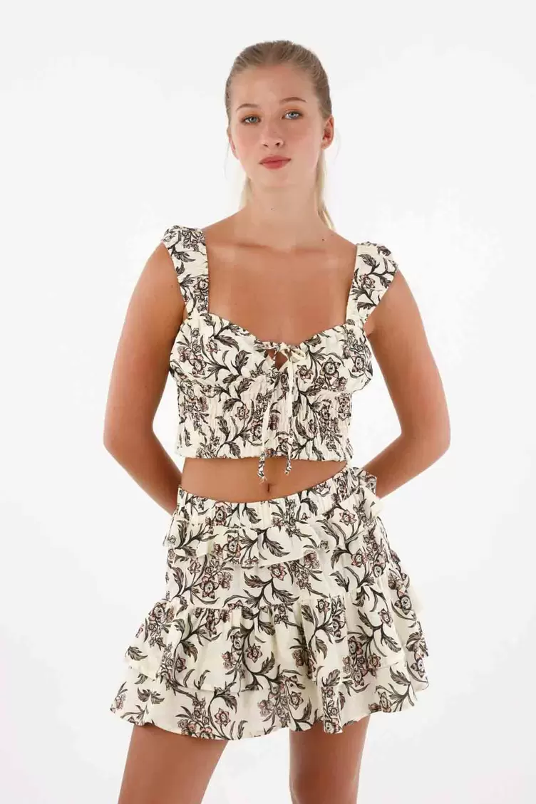 Falda corta con boleros estampada para mujer