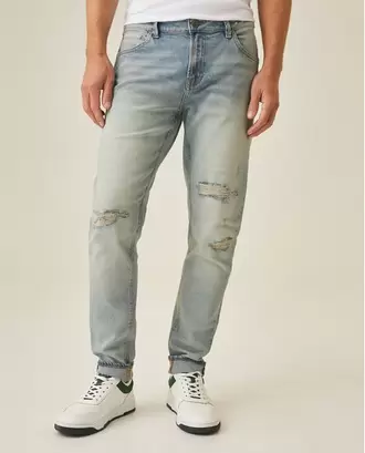 Jean de Hombre Rider Skinny Fit Tiro Bajo Lavado Claro con Rotos, Parches y Estilo Vintage en Mezcla de Algodón