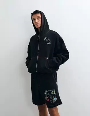 True Religion buddha face back print graphic boxy fit zip up hoodie co-ord in black