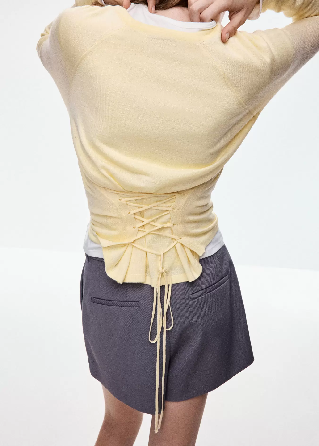 Knit sweater with back tie detail