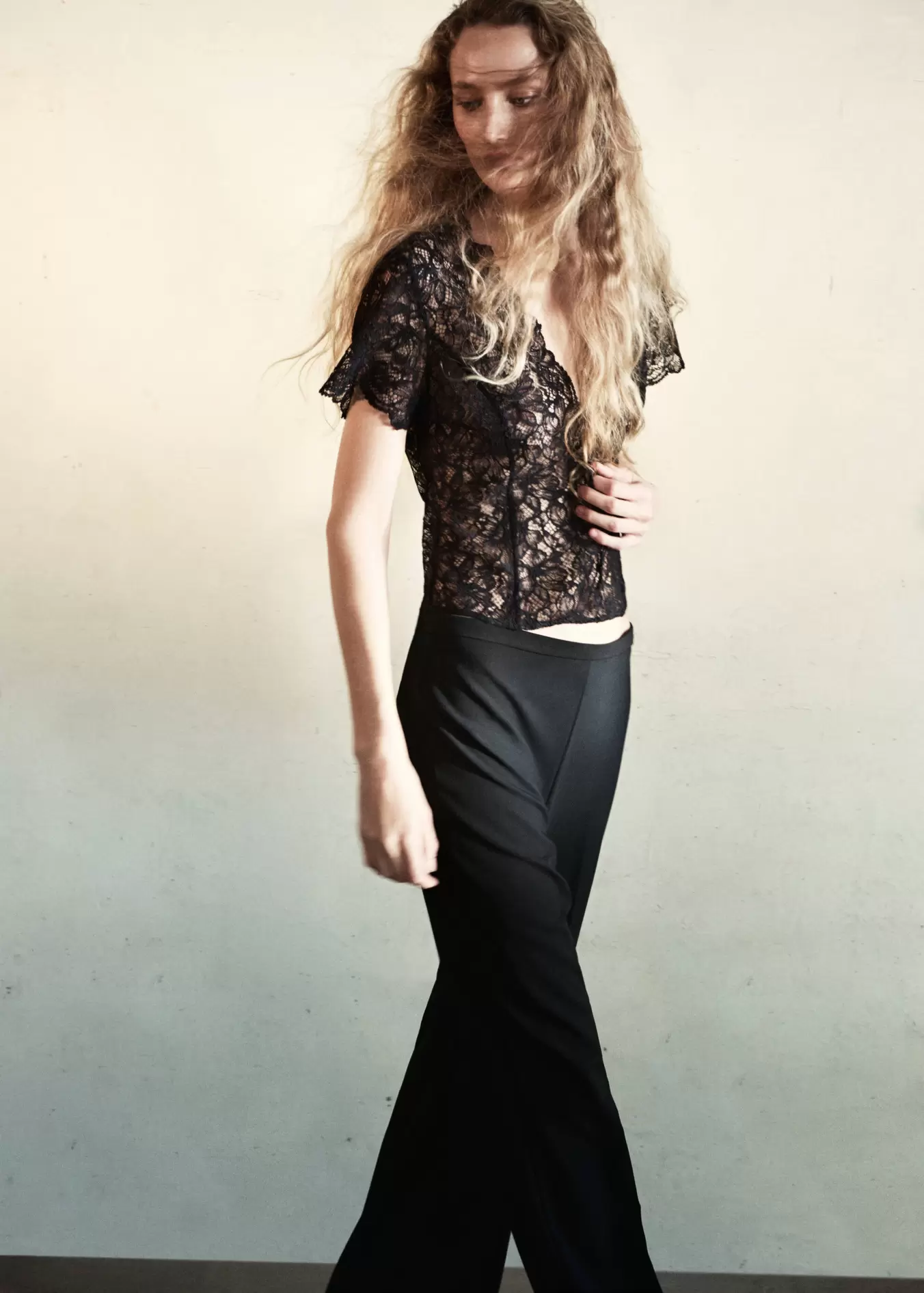 Flared trousers with pressed crease