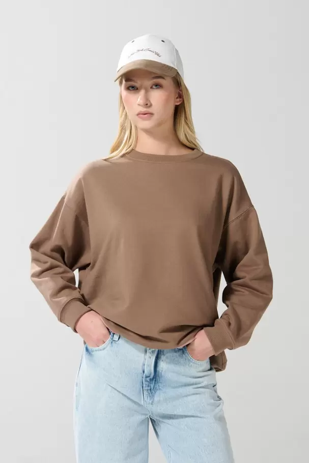 Buzo cuello redondo oversize unicolor con manga ranglan
