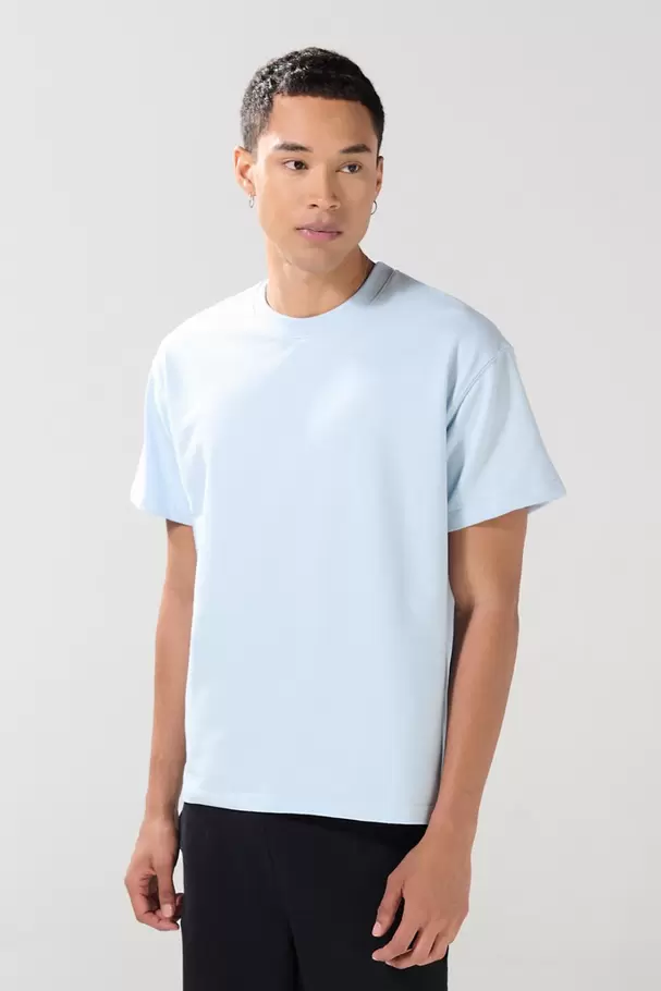 Camiseta en tela pesada unicolor oversize manga corta