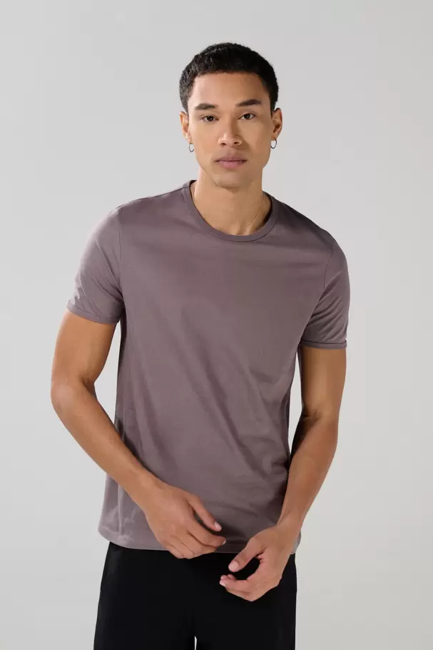 Camiseta en algodón ajustada con cuello redondo unicolor