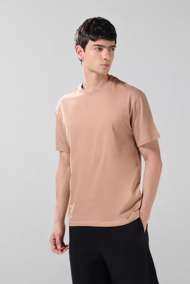 Camiseta en algodón unicolor manga corta con hombro rodado