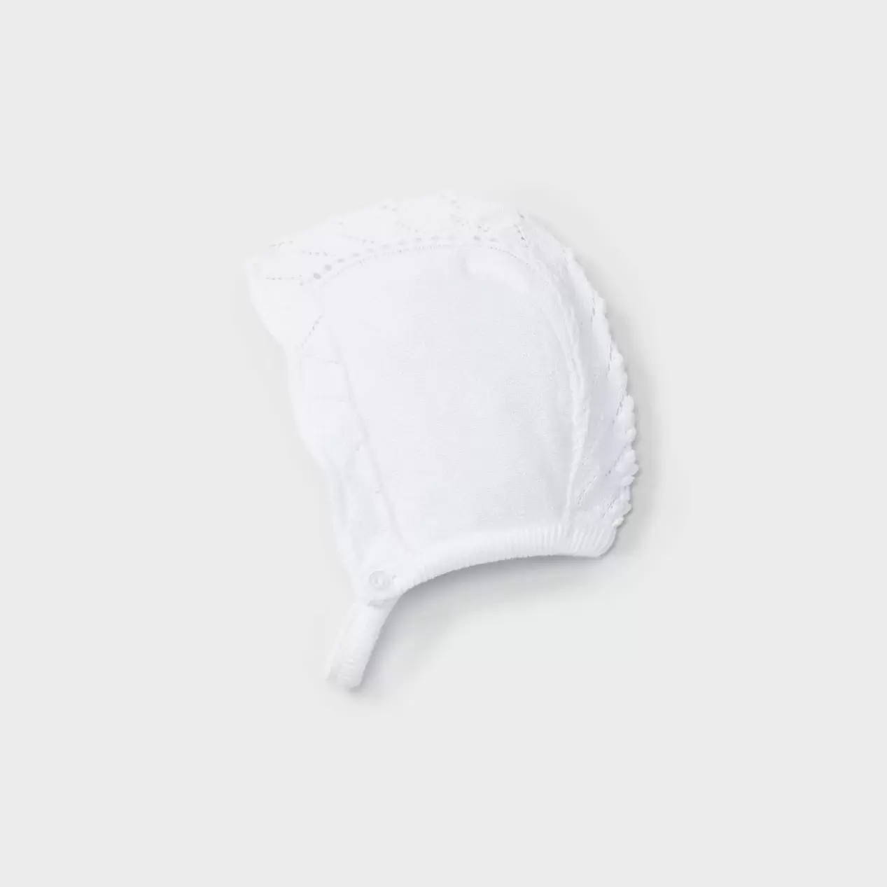 Capota tricotosa blanca y rosa recién nacida
