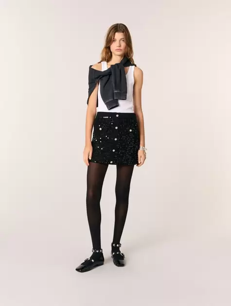 Falda corta de punto y lentejuelas