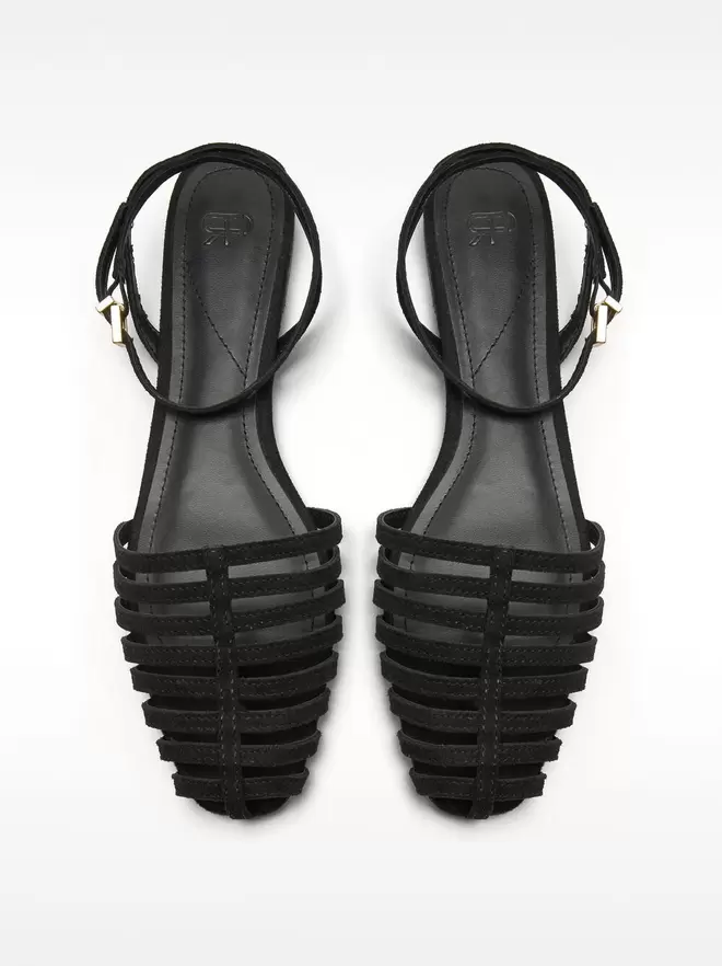 Flat leather sandals with straps