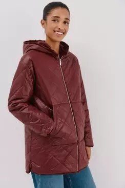 Reversible quilted anorak with fur effect