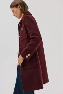 Coat with golden buttons