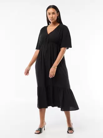 Vestido fluido con estampado fantasía