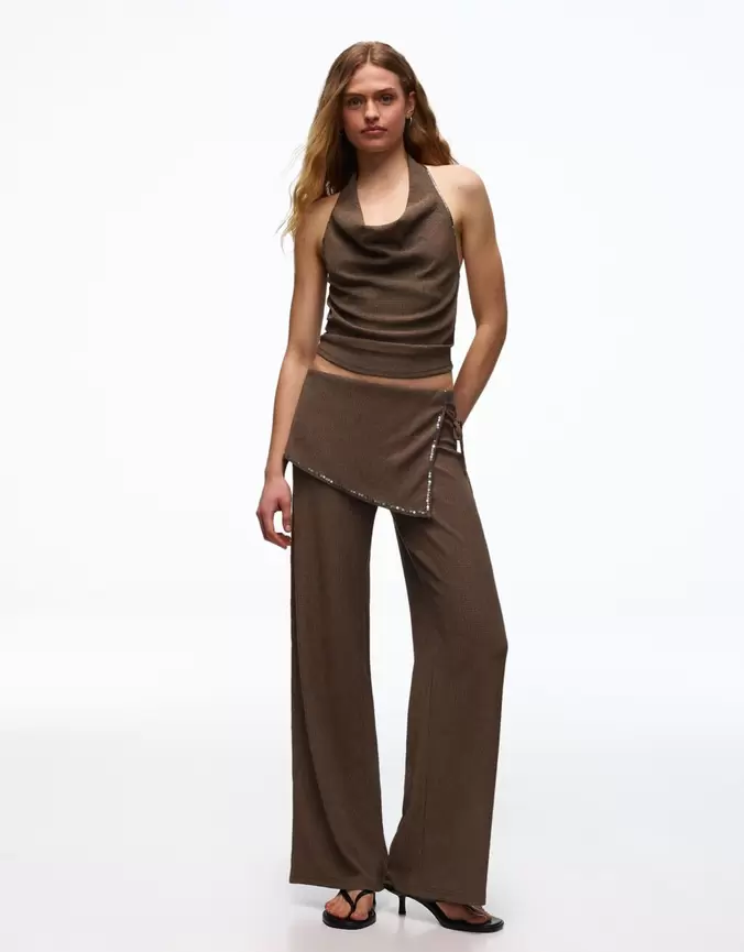 Pantalón con sobre falda lentejuelas