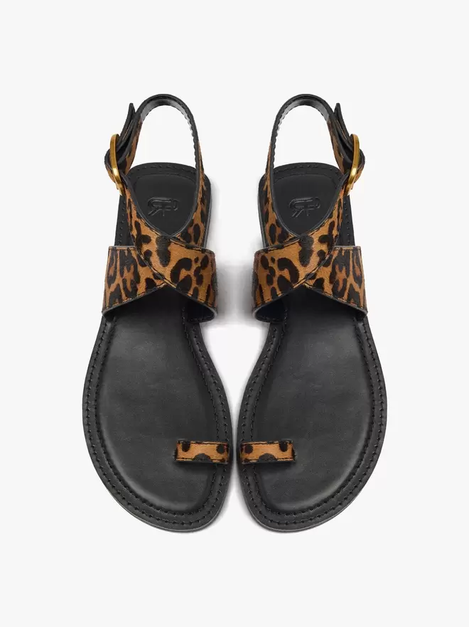Sandalias planas de piel estampado animal