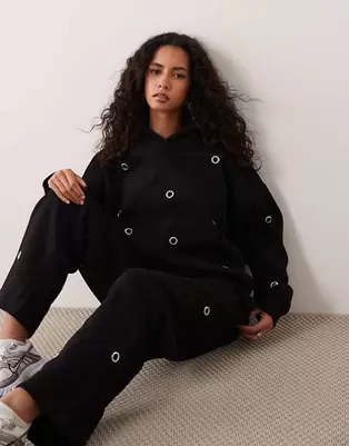 Kaiia - sudadera con capucha extragrande de algodón con detalle de ojales en la parte delantera en negro