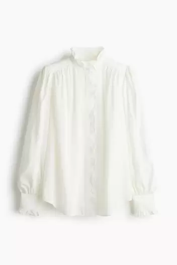 Blusa oversize con ribetes de volante