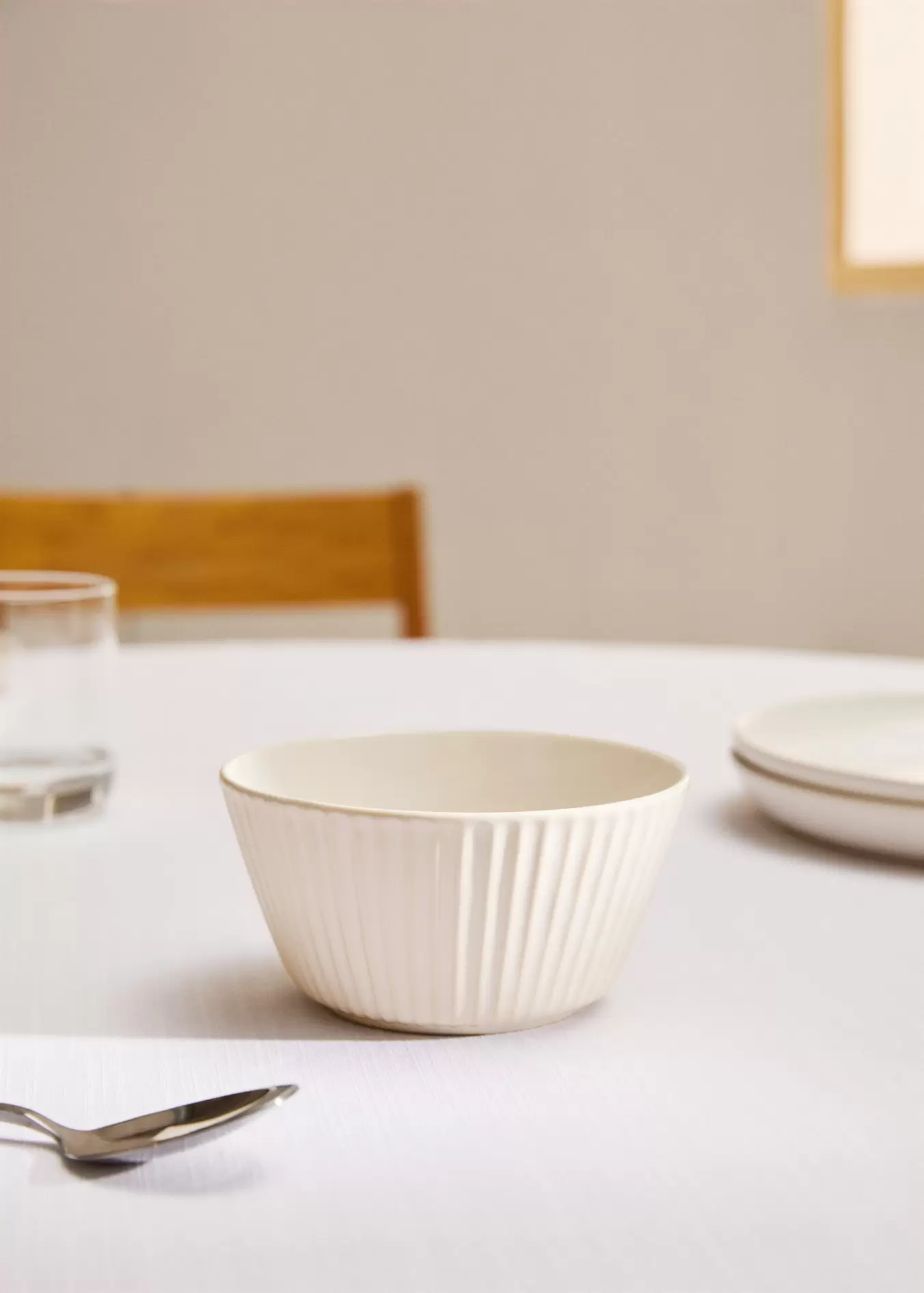Stoneware bowl with wave relief