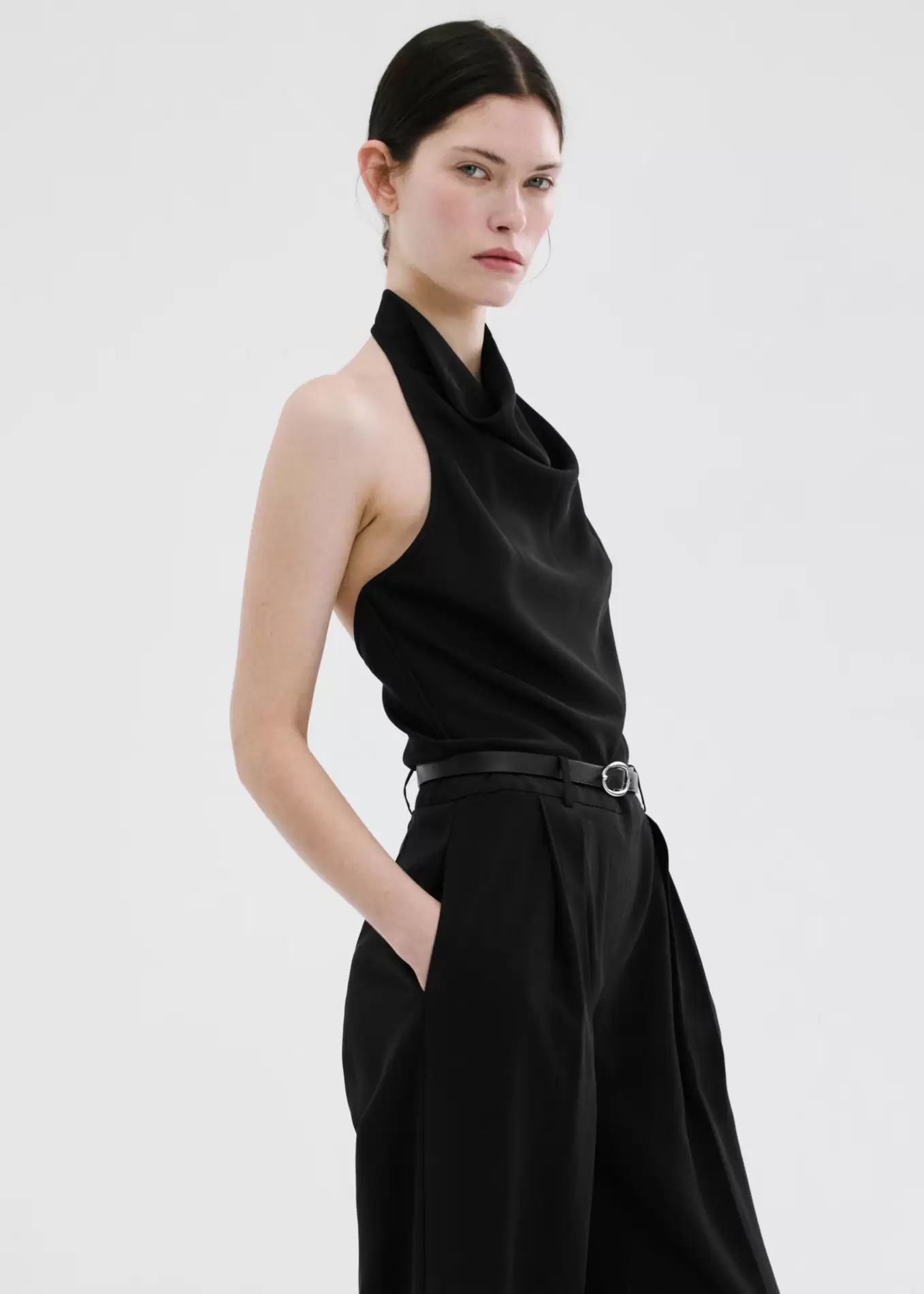 Halter neck jumpsuit with combined detailing
