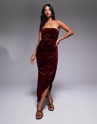 TFNC Petite ruched bandeau dress with uneven hem in burgundy velvet