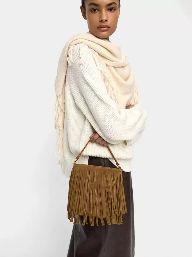 Leather shoulder bag with fringes