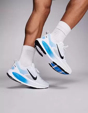 Nike Running Vomero 18 trainers in white and blue