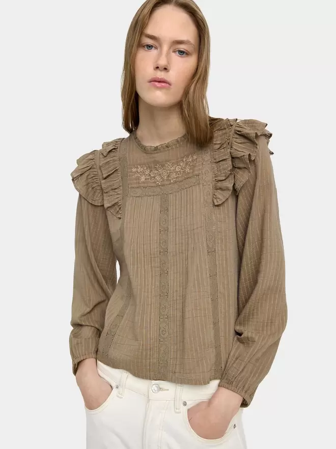 Blouse with embroidery and ruffles