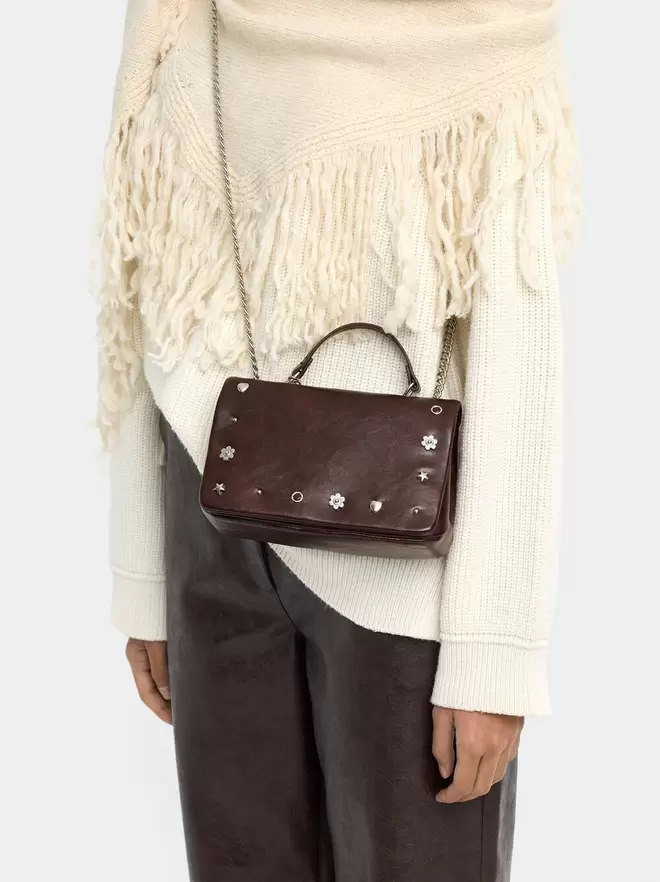 Shoulder bag with flap and metallic details